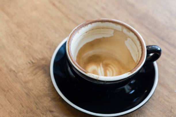 istock Empty coffee cup after drink on wood table In the coffee shop 1065278018
