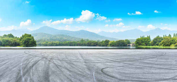 istock Asphalt road pavement and green mountain 1065278250