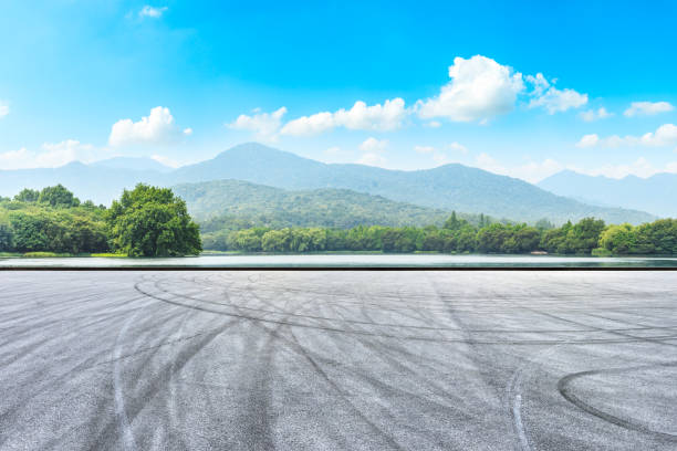 istock Asphalt road pavement and green mountain 1065278286
