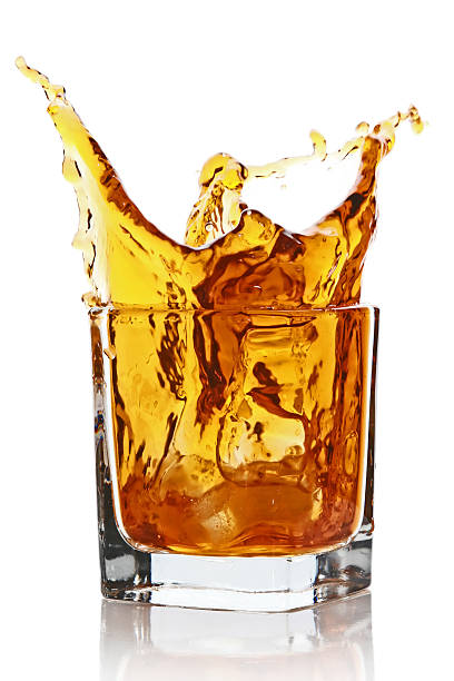 istock Glass with splashing whisky drink 106527970