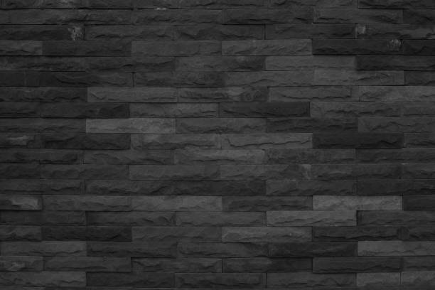seamless modello nero di superficie decorativa in arenaria in mattoni con cemento di design moderno decorativo irregolare hanno rotto la parete in vera sabbia di pietre multicolori o blocchi con cemento. - retro revival pattern masonry old foto e immagini stock