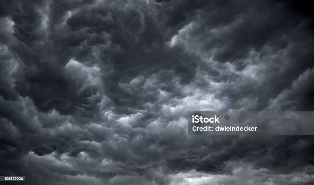 Threatening dark clouds covering the sky Dark, Ominous Clouds Promise Rain and poor Weather. Storm Cloud Stock Photo