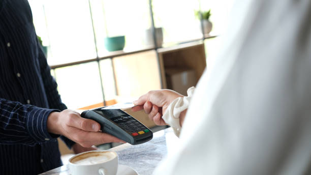 istock Tap and Pay for my coffee at the cafe 1065294098