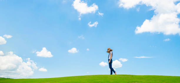 istock Woman relaxing in a meadow 1065298132