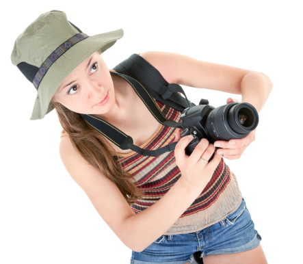 young girl tourist with camera on white