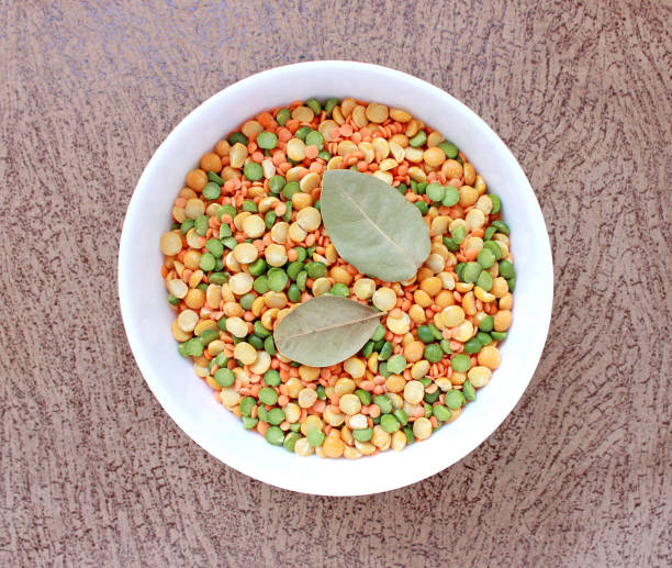 white plate with peas, leaf and lentils
