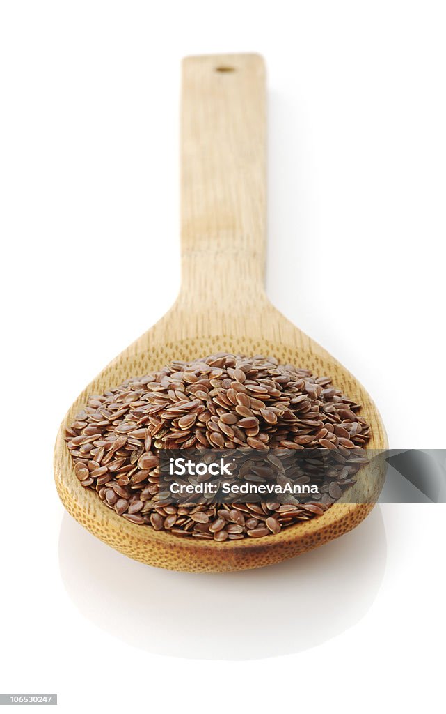 Seme di lino in cucchiaio di legno - Foto stock royalty-free di Alimentazione sana