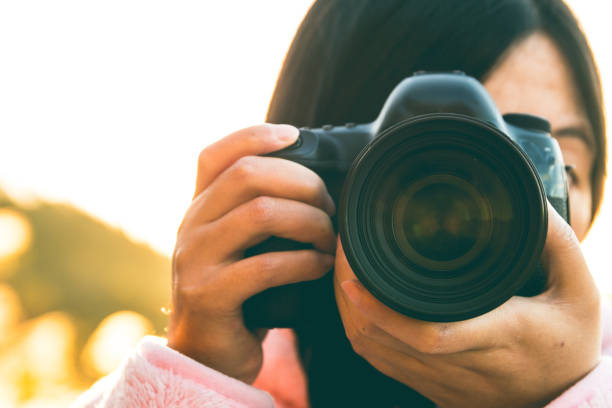 istock Young woman photographing 1065303670