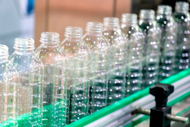 istock The new plastic bottles on the conveyor belt . 1065307262