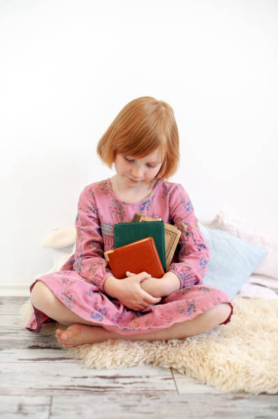 istock The girl hugs her favorite book 1065309778