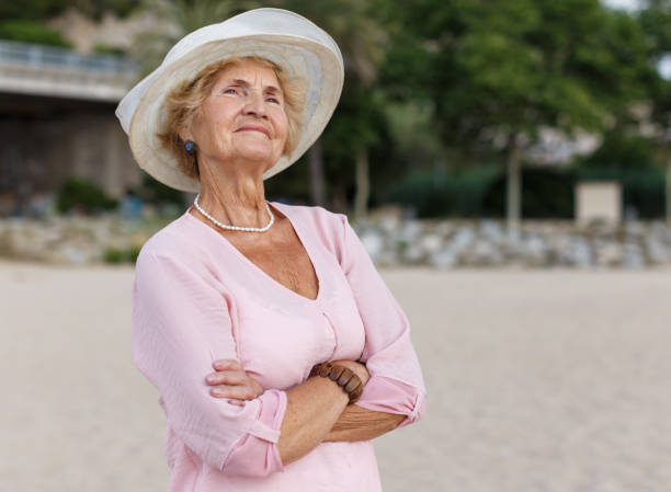 istock Senior woman relaxing at seaside 1065309886