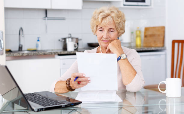 istock Woman filling up documents 1065309966