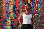 Girl in front of African Textiles