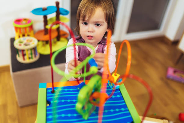 istock Cute child playing on table indoor 1065315286