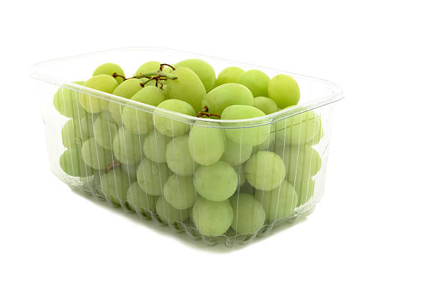 Grapes in a plastic punnet on white background punnet of grapes stock pictures, royalty-free photos & images