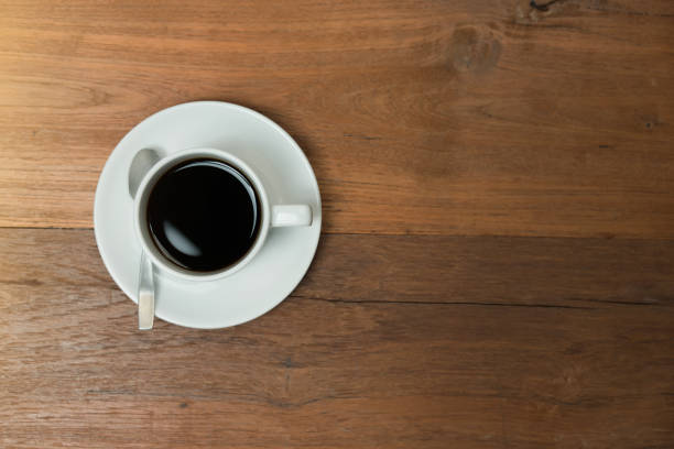 istock Top view coffee cup on wood table 1065316030