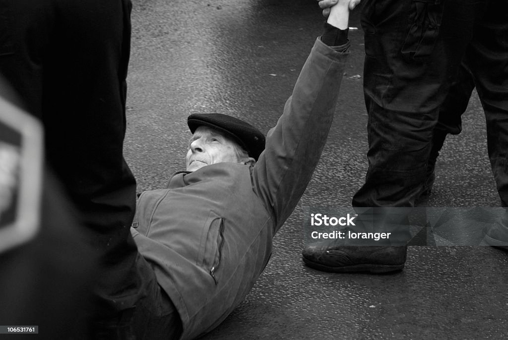 Violent protest Old man brutalised by policemen of the riot squad during a political demonstration in the streets of St. Petersburg, Russia. Protest Stock Photo