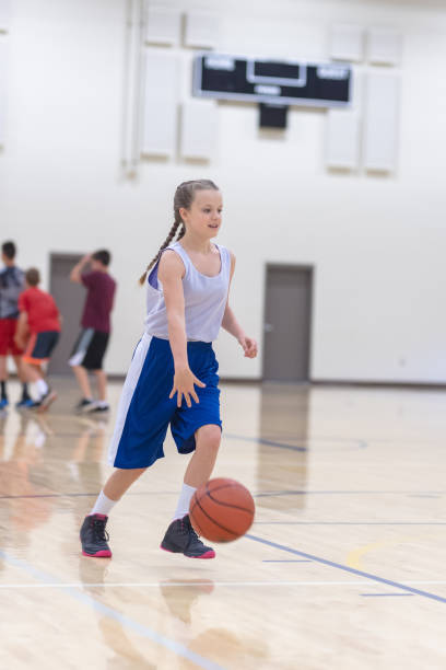 istock Co-ed teen basketball team practicing 1065320202