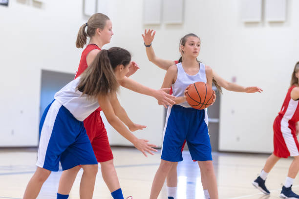 istock Elementary girls basketball practice 1065320718