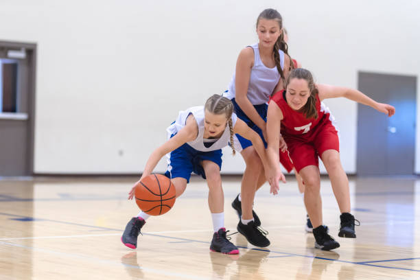 istock Elementary girls basketball practice 1065320720