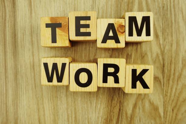 istock teamwork word made from wooden cubes with letters alphabet 1065324530