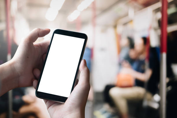 istock Close up Woman hand Using a Smart Phone with blank screen at Train. 1065326896