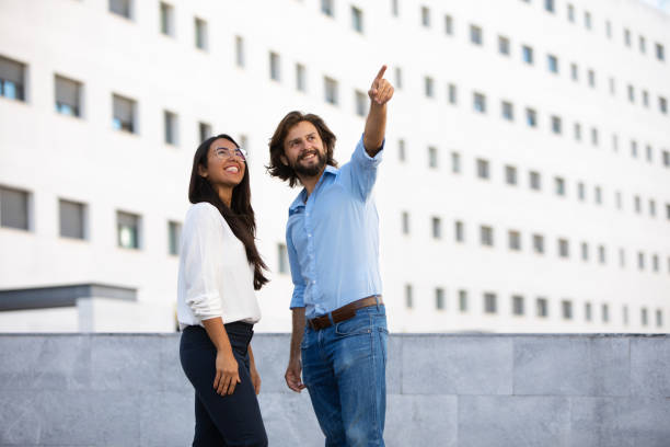 istock Successful architect showing office building to smiling colleague 1065334880