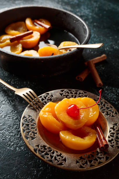 istock Peach dessert with cinnamon and  cherry. 1065336146
