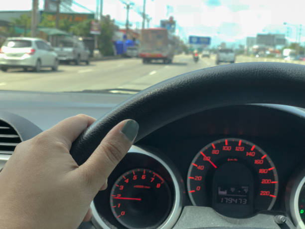 istock woman hand on the steering wheel 1065336980