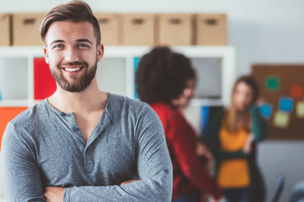 istock Smiling man's portrait in college 1065338796
