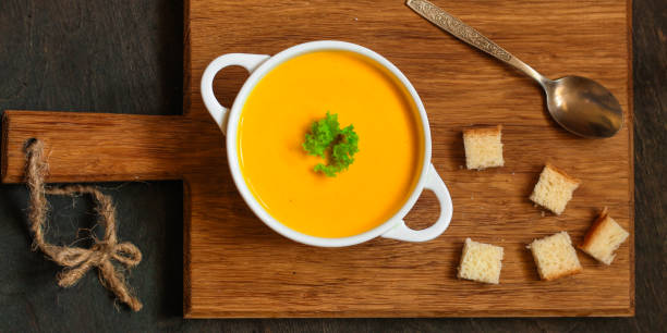 istock pumpkin soup (orange sweet potatoes). Healthy food. Copy space. Top view 1065339400