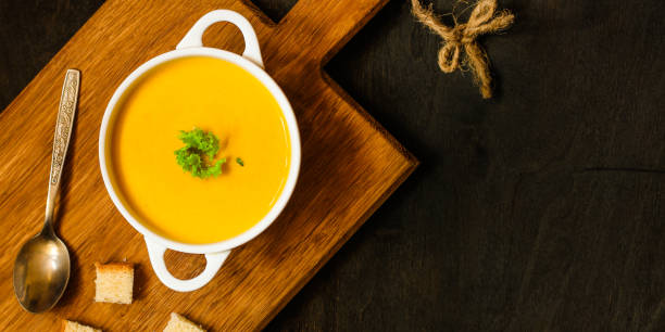 istock pumpkin soup (orange sweet potatoes). Healthy food. Copy space. Top view 1065339422