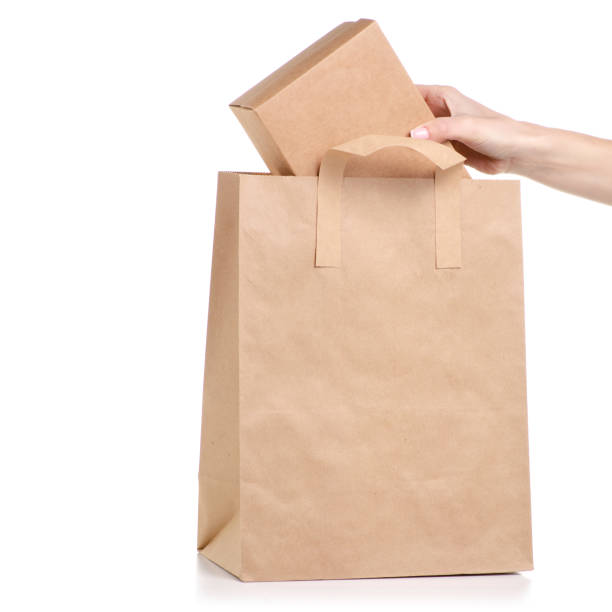 istock Paper bag package box in hand 1065342058