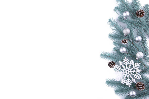 istock Christmas tree branches with christmas decoration on a white background 1065344414