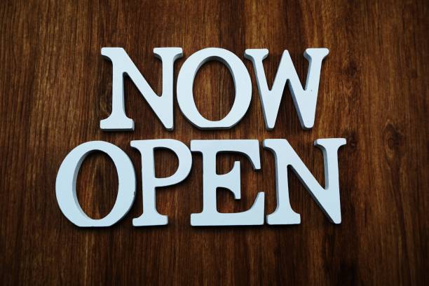 istock now open alphabet letters top view on wooden background 1065345794