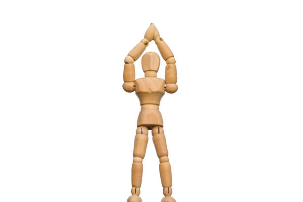 istock Isolated wooden figure makes a victory pose 1065346162