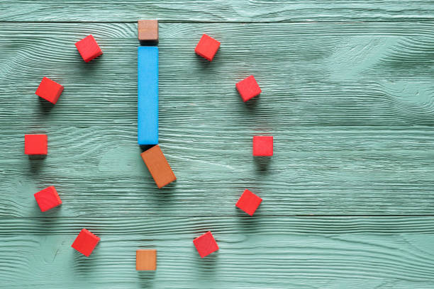 istock Colorful clock from wooden cubes, one hour. 1065346742