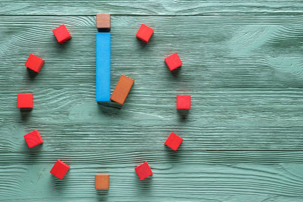 istock Colorful clock from wooden cubes, one hour. 1065346744