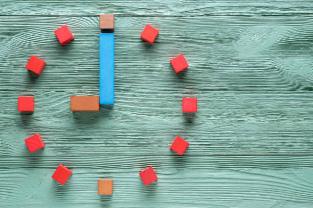 istock Colorful clock from wooden cubes, nine hour. 1065346764