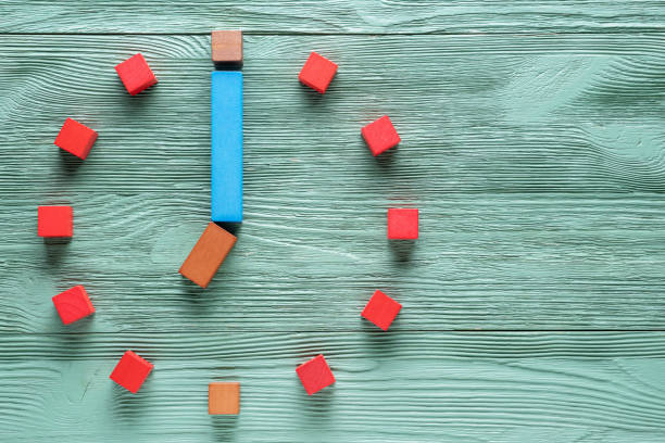 istock Colorful clock from wooden cubes, seven hour. 1065346772