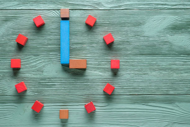 istock Colorful clock from wooden cubes,  three hour. 1065346778