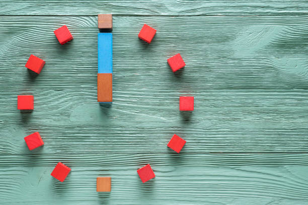 istock Colorful clock from wooden cubes, twelve hour. 1065346808