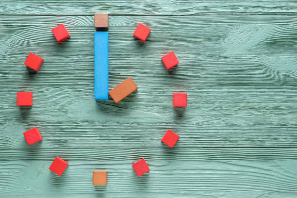 istock Colorful clock from wooden cubes, two hour. 1065346826