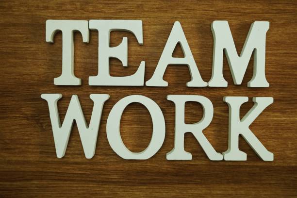 istock team work word made from wooden cubes with letters alphabet 1065347504