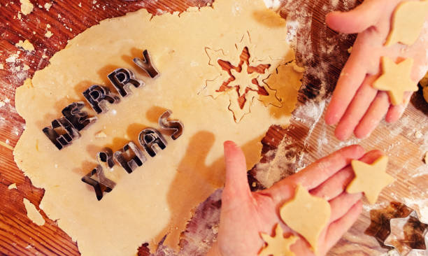 istock Real christmas bakery - Children are making christmas cookies 1065354872