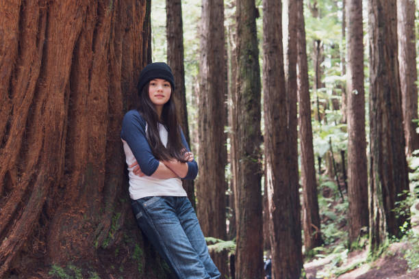 Portrait of confident girl in a Redwood forest stock photo