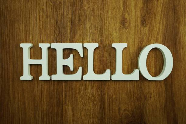 istock hello alphabet letter with space copy on wooden background 1065355662