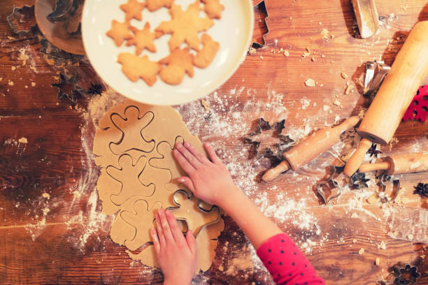 istock Real christmas bakery - Child is making christmas cookies 1065358354