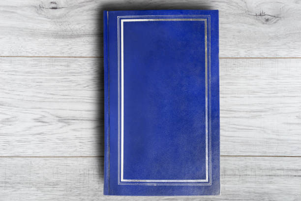 istock Book on wooden background 1065360984