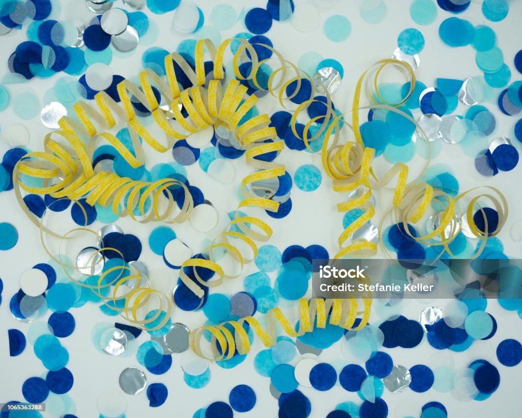 Background Of Blue Confetti And Yellow Streamers Stock Photo - Download  Image Now - Anniversary, Backgrounds, Blue - iStock